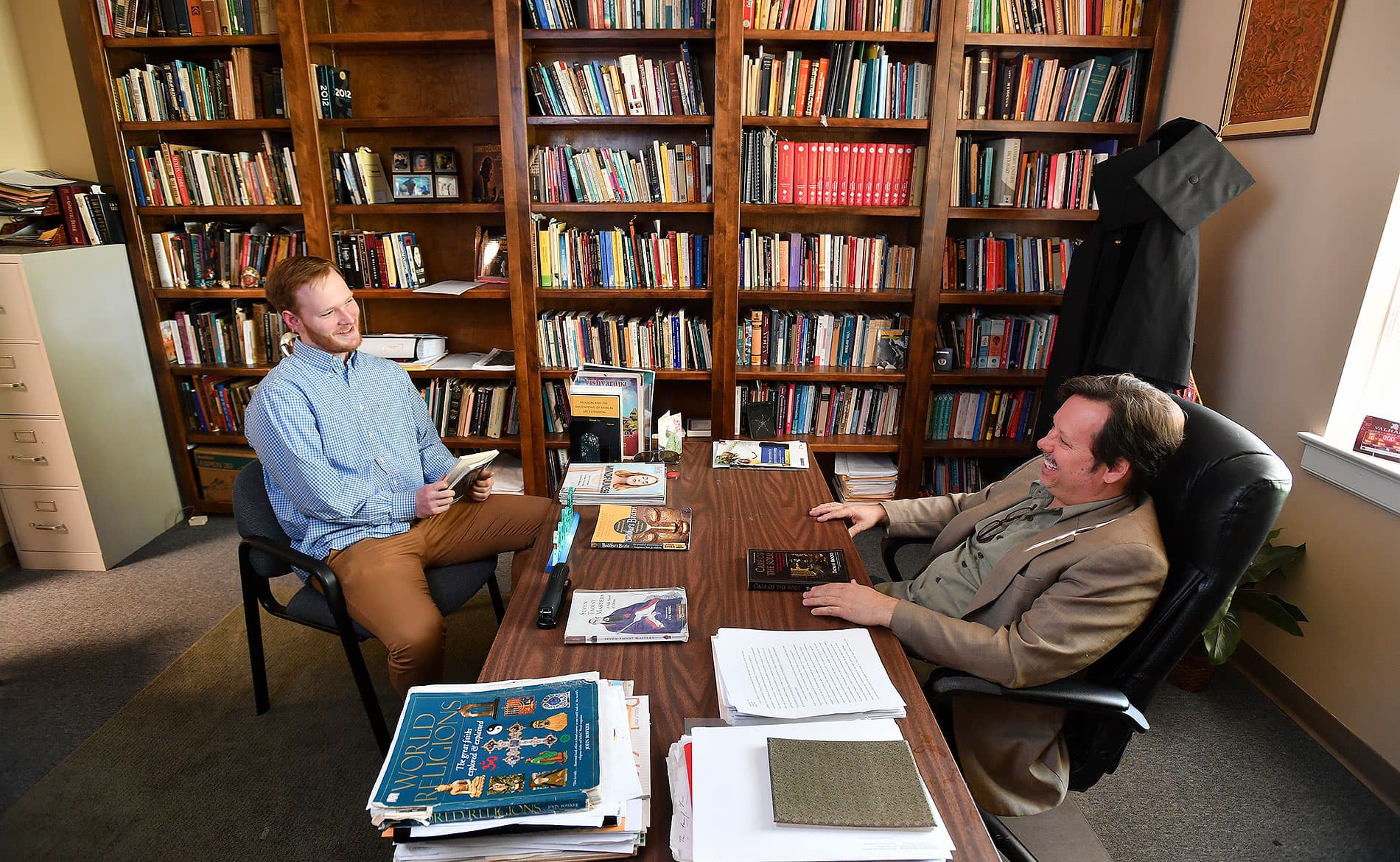 A student visiting a professor's office