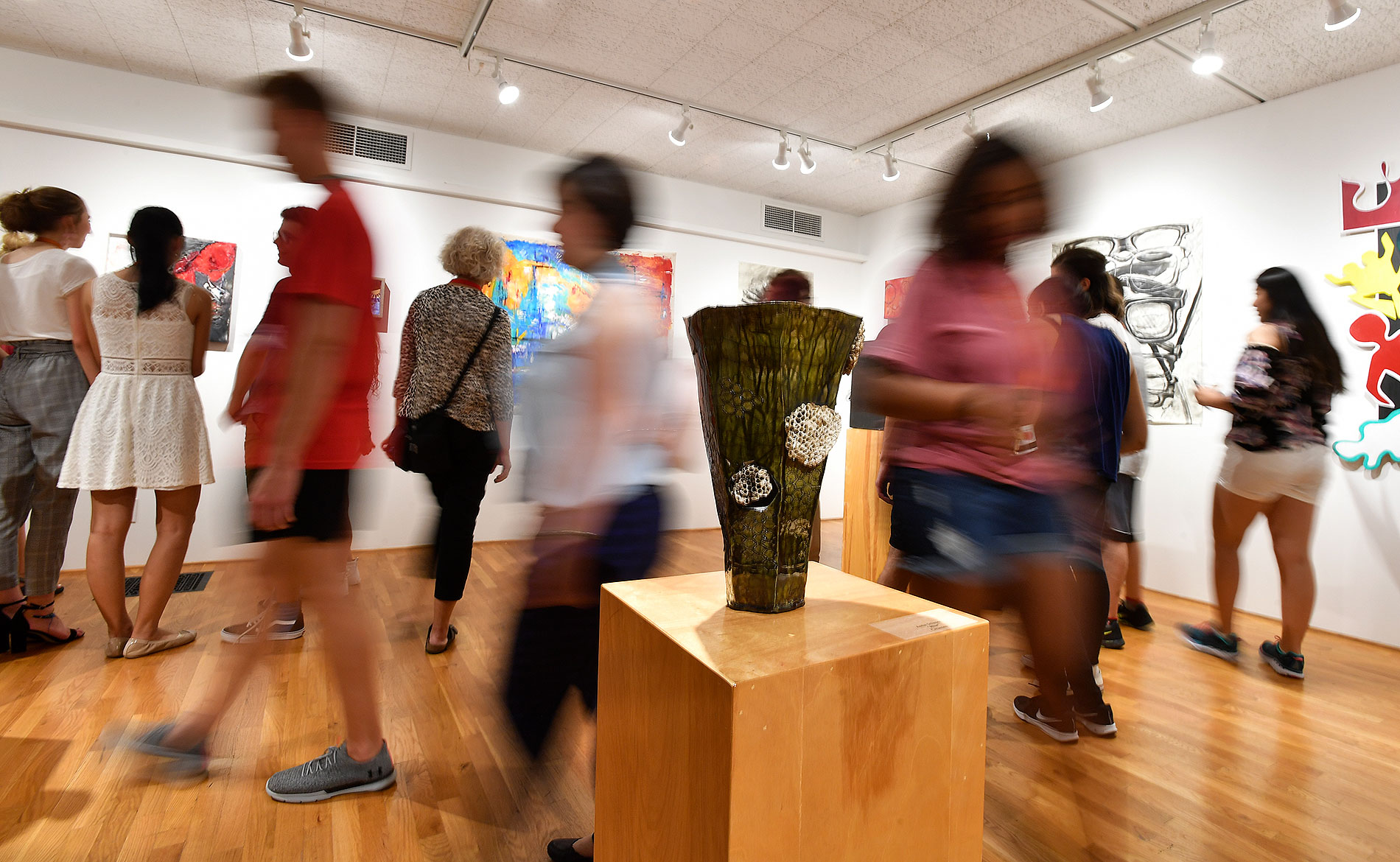 People viewing an art exhibit