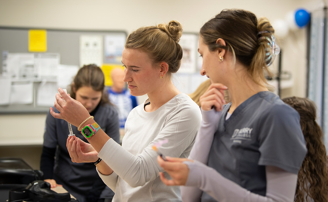 Students preparing an injection